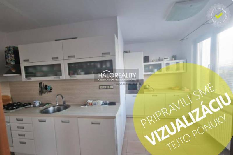 Küche in einer 3-Zimmer-Wohnung mit weißen Schränken und einem Gasherd.