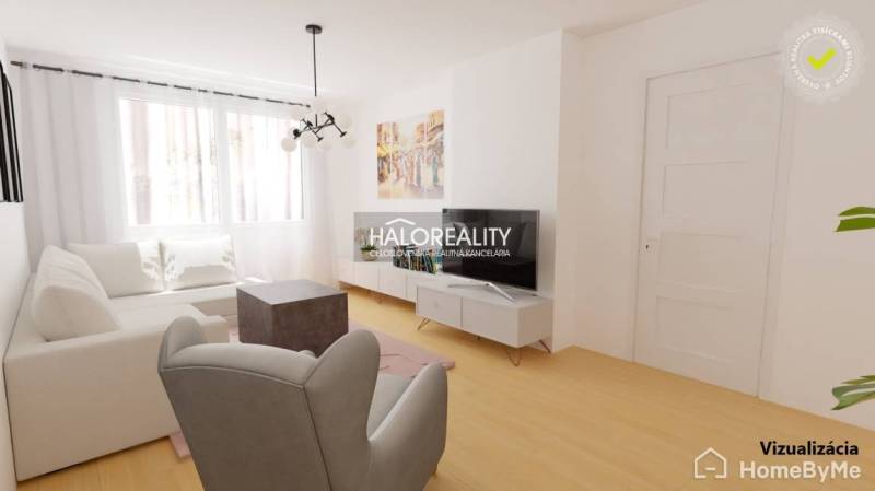 Wohnzimmer mit weißen Möbeln und Fernseher in einer 3-Zimmer-Wohnung.