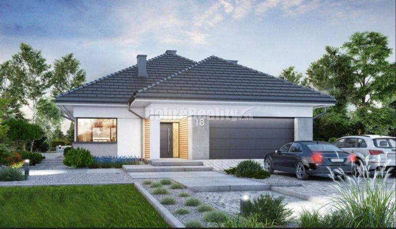 Ein Einfamilienhaus in Hurbanovo mit Garage und Garten, umgeben von Grünflächen und einer Zufahrtsstraße.