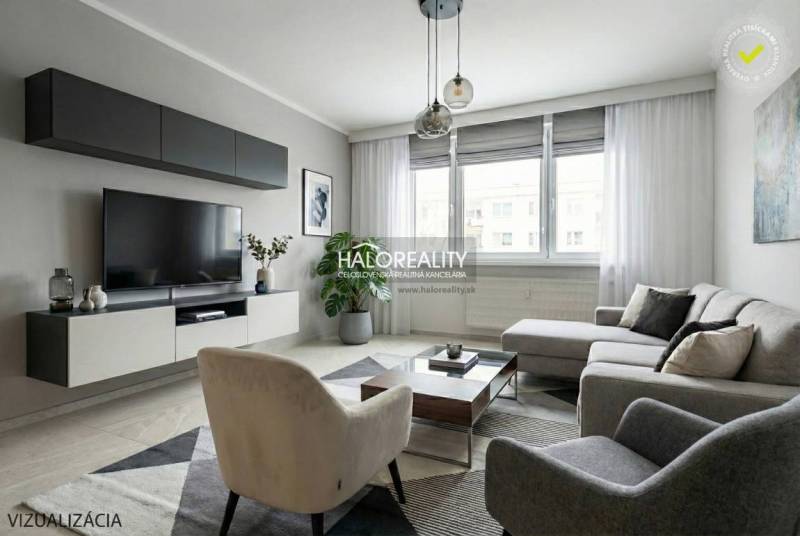 Wohnzimmer in einer 3-Zimmer-Wohnung mit großem Sofa, Fernseher, Teppich, Holzboden.