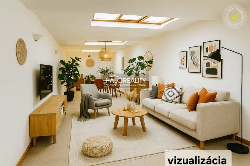 Heller Geschäftsraum mit Sofa, Pflanzen und Wanddekorationen.