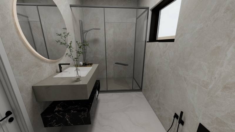 Badezimmer mit Waschbecken, Duschkabine und Fenster in einem Einfamilienhaus.