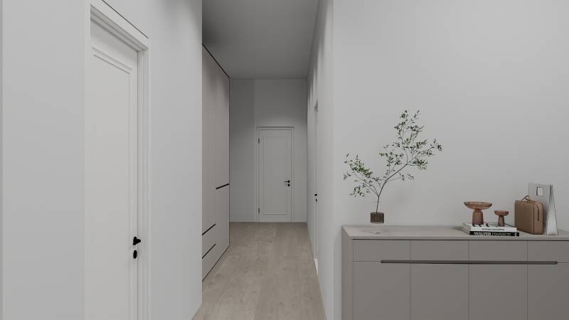 Der Flur in einem Einfamilienhaus mit einem Boden in Holzoptik und einfacher Einrichtung.