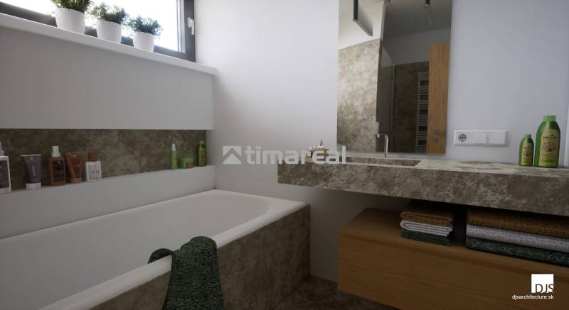 Ein Badezimmer mit Badewanne und Waschbecken, umgeben von natürlichen Dekoren und Stauraum.