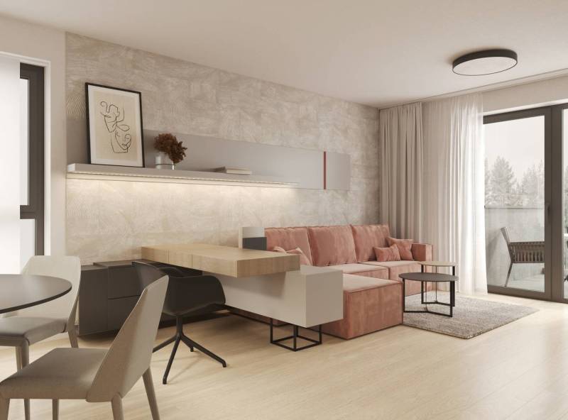 Wohnzimmer mit beiger Wand, rosa Sofa und Holzboden.