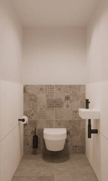 Eine Toilette mit hängender Schüssel und gemusterten Fliesen in einem Gebäude, elegantes Design.