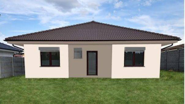 Ein Einfamilienhaus in der Kolonie, Galanta, mit einem dunklen Dach und einem grasbewachsenen Garten.