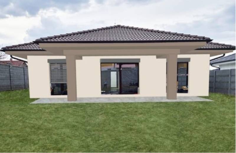 Ein Einfamilienhaus in der Kolónia in Galanta mit Rasen und großen Fenstern zur Terrasse.