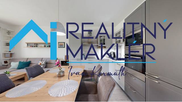 Interieur eines Einfamilienhauses mit Küche, Esstisch und Wohnzimmer.