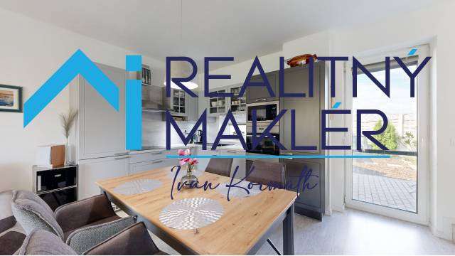 Küche im Einfamilienhaus mit Esstisch und Zugang zur Terrasse.