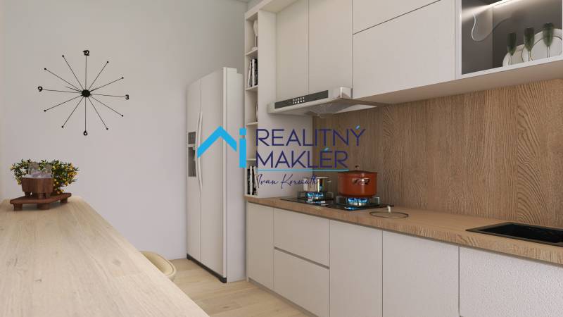 Eine Küche mit Holzboden, Uhr und modernen Geräten in einer 3-Zimmer-Wohnung.