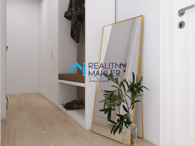 Der Flur in einer 3-Zimmer-Wohnung mit einem Holzboden und einem großen Spiegel.