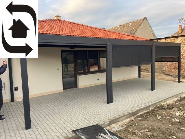 Ein Einfamilienhaus in Bratislava - Podunajské Biskupice in der Devätinova-Straße hat eine überdachte Terrasse.