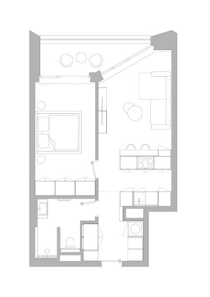 Grundriss einer 2-Zimmer-Wohnung mit Wohnzimmer, Küchenzeile und Schlafzimmer.