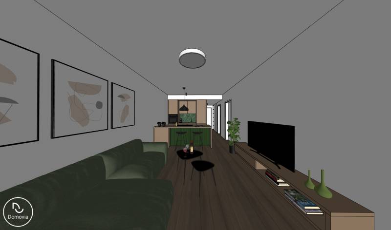 Wohnzimmer mit Sofa, Fernseher, Küchenzeile und Holzboden in einer Zweizimmerwohnung.