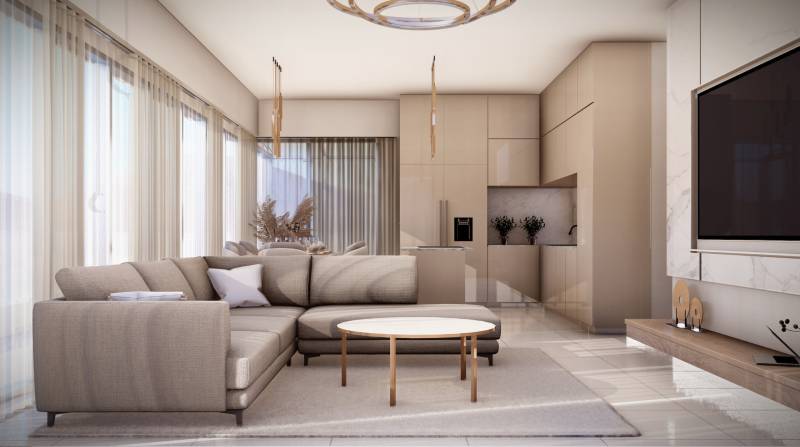 Wohnzimmer mit Sofa, Tisch und Küchenzeile in einer 4-Zimmer-Wohnung.