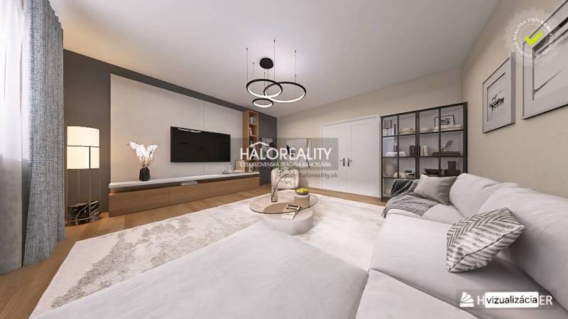 Ein stilvolles Wohnzimmer mit Holzboden in einer 4-Zimmer-Wohnung, bequeme Couch.