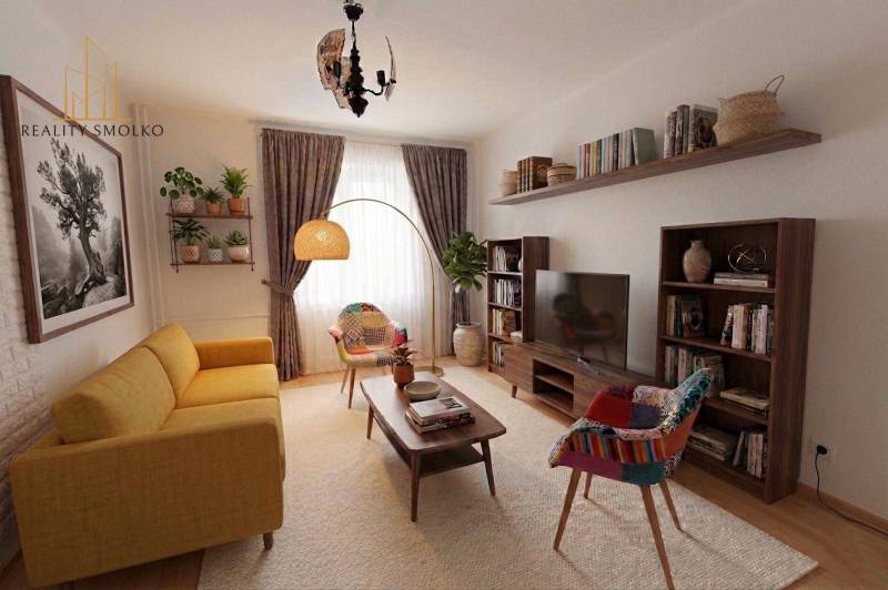 Ein stilvolles Wohnzimmer in einer Zweizimmerwohnung mit einem bequemen Sofa und Holzregalen.