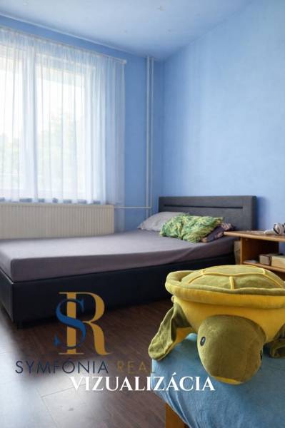 Kinderzimmer in einem Einfamilienhaus mit blauen Wänden und einem Boden in Holzoptik.