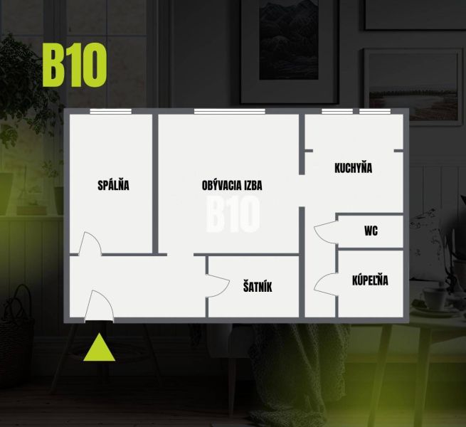 Grundriss einer 2-Zimmer-Wohnung mit Wohnzimmer, Schlafzimmer, Küche, Badezimmer und Ankleidezimmer.