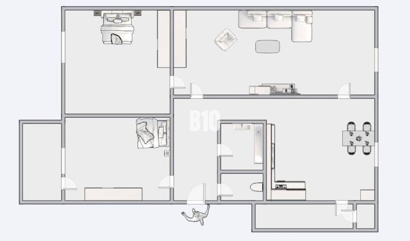Grundriss einer 3-Zimmer-Wohnung mit Wohnzimmer, Küche und Schlafzimmern.