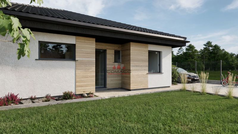Ein Einfamilienhaus in der Kostolná-Straße in Drahovce mit Holzverkleidung und gepflegtem Garten.
