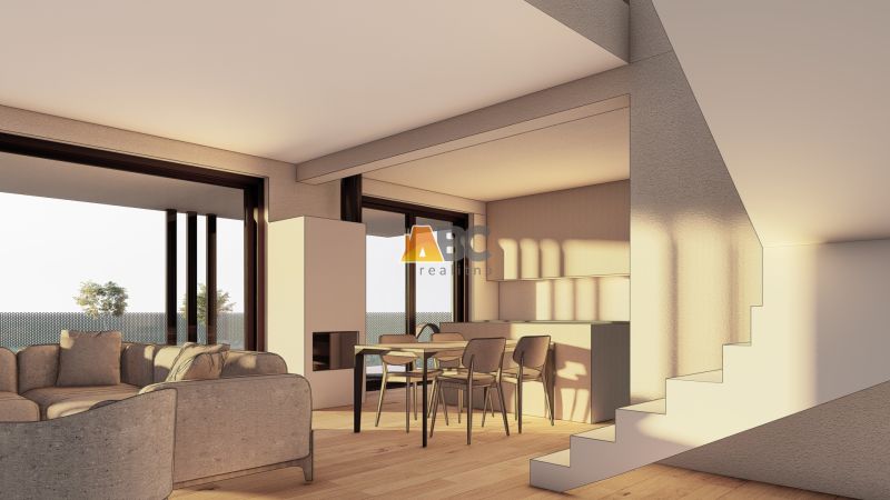 Offener Wohnbereich mit Sofa, Esstisch und Holzboden.