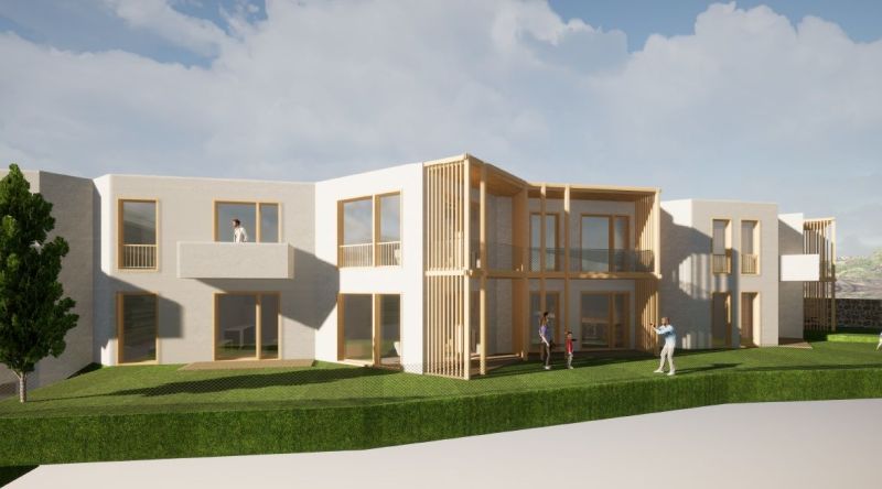 Ein Gebäude mit Balkonen und Holzelementen in Nová Lesná, geeignet für Hotels und Pensionen.