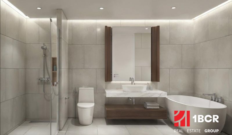 Badezimmer in einer 2-Zimmer-Wohnung mit Badewanne, Dusche und modernem Waschbecken.