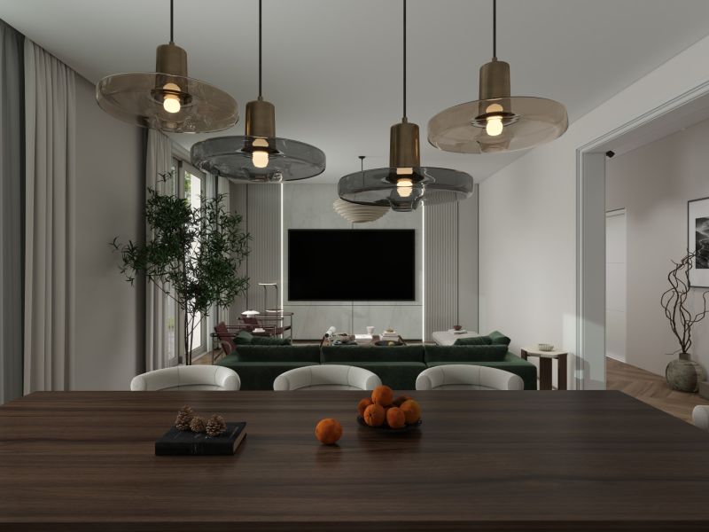 Esszimmer in einem Einfamilienhaus mit Holztisch, Hängelampen und Blick auf das Wohnzimmer.