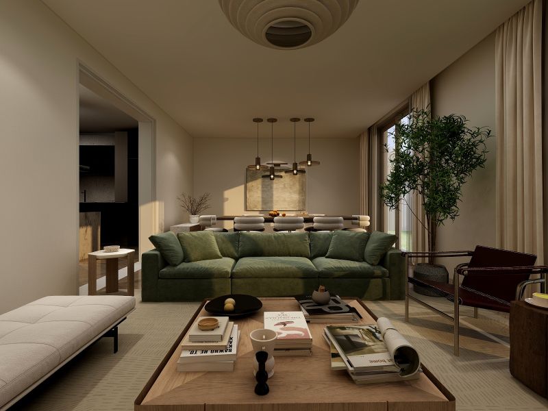 Wohnzimmer in einem Einfamilienhaus mit einem bequemen grünen Sofa, einem Tisch und Kerzenhaltern.