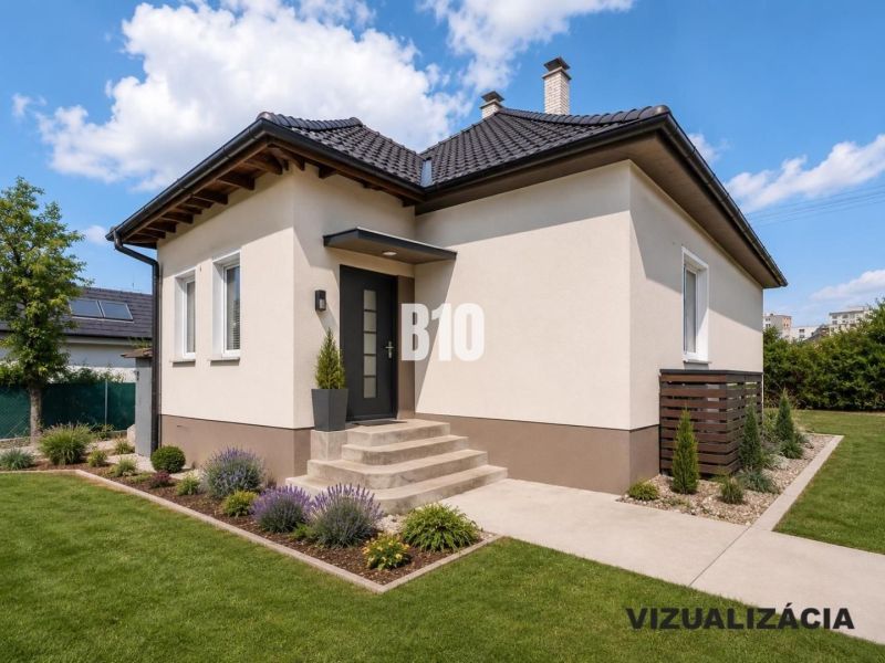 Ein Einfamilienhaus in Nitra mit Garten, Rasen und Zierpflanzen unter blauem Himmel.