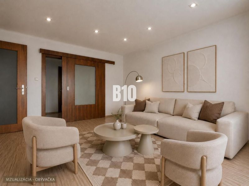 Wohnzimmer in einer 3-Zimmer-Wohnung mit Holzboden und neutralen Möbeln.
