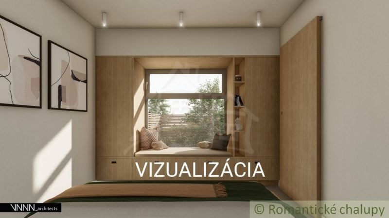 Das Innere eines Einfamilienhauses mit einer gemütlichen Sitzecke am Fenster.