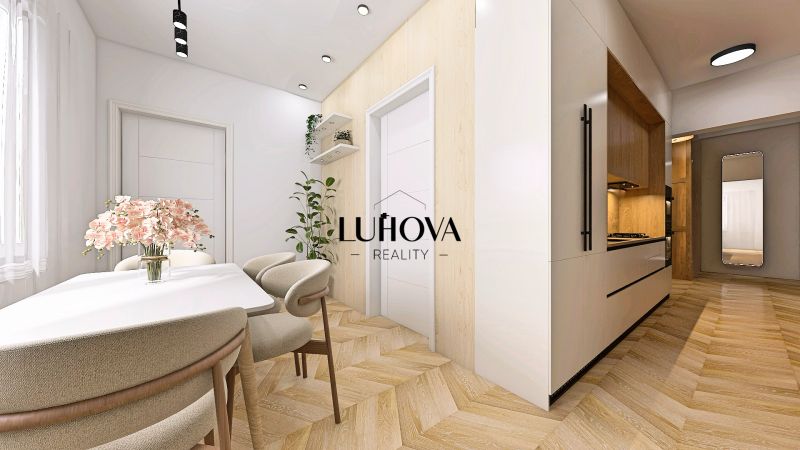 Innenraum einer 2-Zimmer-Wohnung mit Holzboden und elegantem Esstisch.