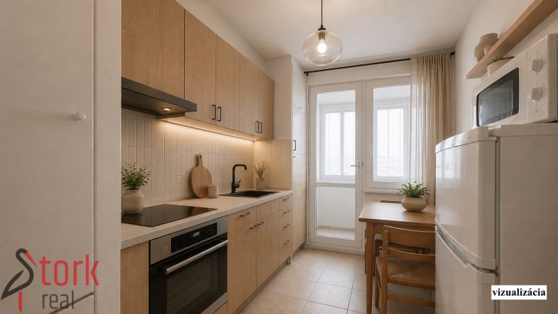 Küche in einer 2-Zimmer-Wohnung mit Holzboden und Esstisch.