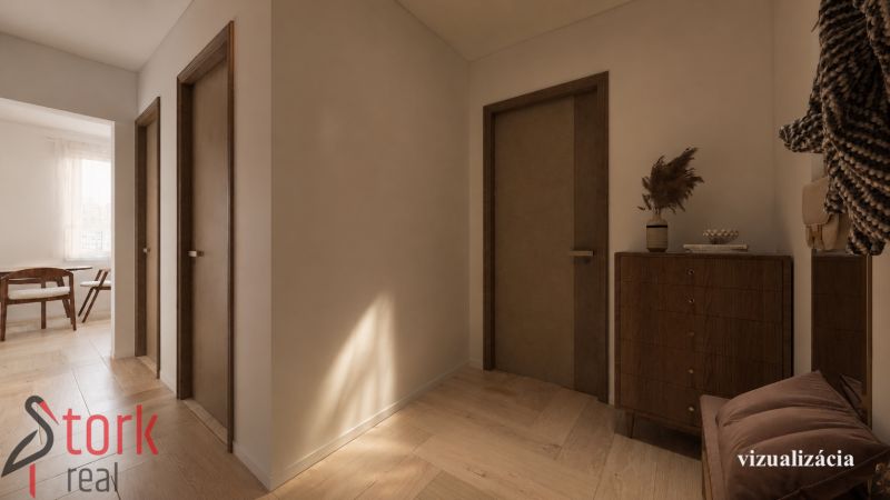 Flur in einer 2-Zimmer-Wohnung mit einem Boden in Holzoptik und sanfter Beleuchtung.