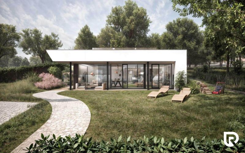 Ein Einfamilienhaus in Častkovce mit einer verglasten Fassade, Gartenmöbeln und einer gepflegten Rasenfläche.