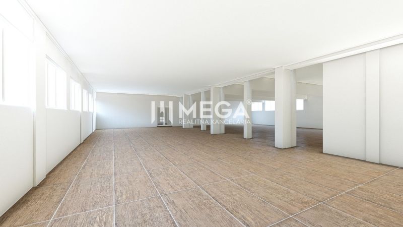 Geräumige Geschäftsräume mit Holzboden und weißen Wänden.
