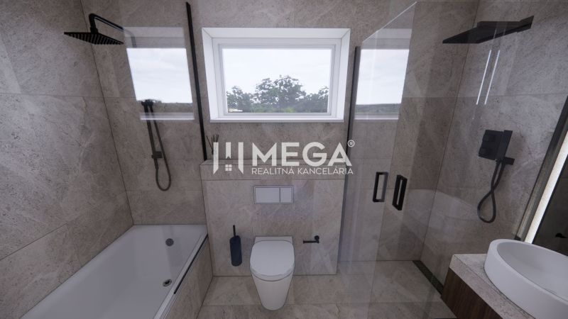 Ein Badezimmer in einem Einfamilienhaus mit moderner Ausstattung, Badewanne und Dusche.