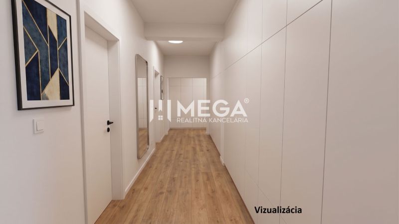 Ein Flur in einem Einfamilienhaus mit einem Boden in Holzoptik und moderner Kunst an der Wand.