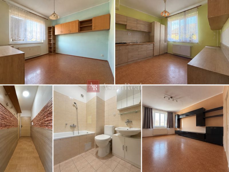 Innenraum einer 2-Zimmer-Wohnung mit Holzboden und heller Küche.