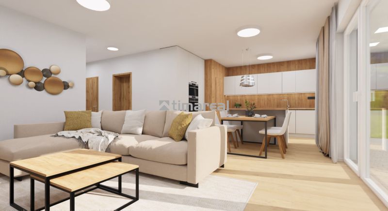 Innenraum eines Einfamilienhauses mit cremefarbenem Sofa und Küche, Boden mit Holzdekor.
