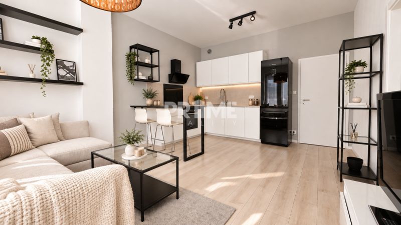 Eine stilvolle 2-Zimmer-Wohnung mit Holzboden und moderner Küche.